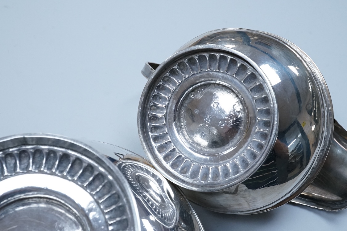 A George III Scottish silver two handled sugar bowl and matching cream jug, Robert Gray & Son, Edinburgh, 1814, sugar bowl height including handles, 11.5cm, 22.8oz.